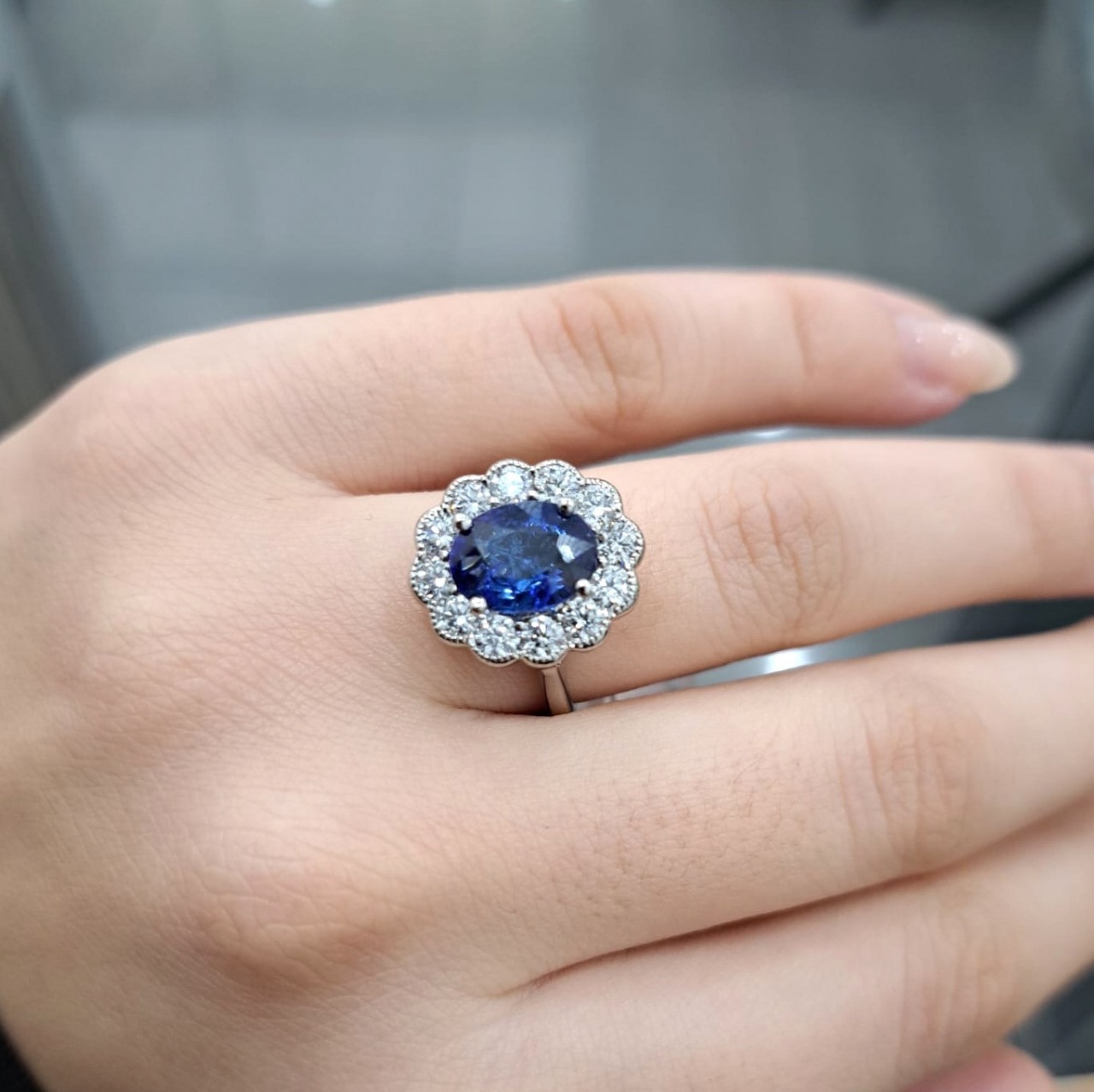 3-50ct-sapphire-oval-diamond-cluster-engagement-ring-in-platinum